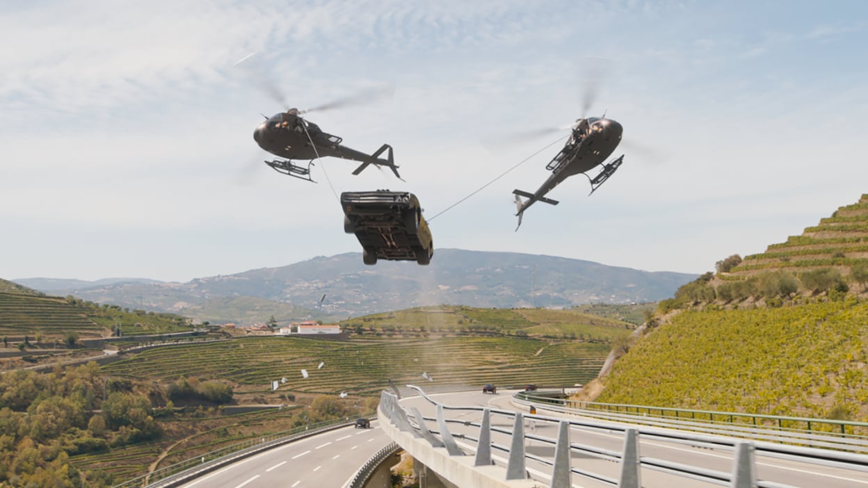 A car is suspended between two helicopters in "Fast X."