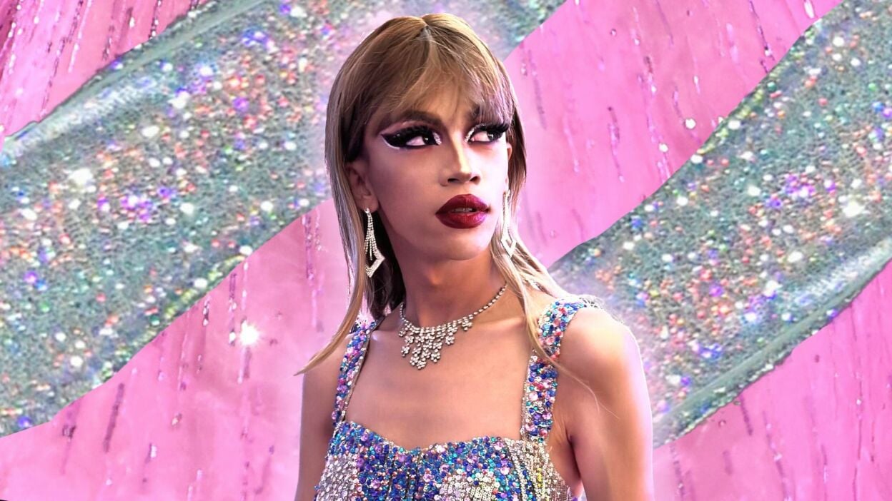A photo of Mac as Taylor (in a blonde wig and handmade rhinestoned top).
