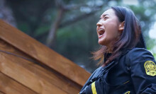 A screenshot of a woman yelling in "Siren: Survive the Island"
