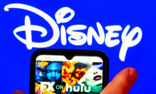 The FX on Hulu logo is displayed on a smartphone screen with a Disney logo in the background. 