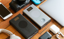 Two power banks surrounded by smart devices.