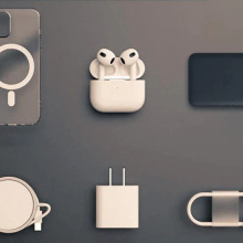 Apple charging cable, adapter, protective case, and other accessories laid out in two rows of three accessories each.