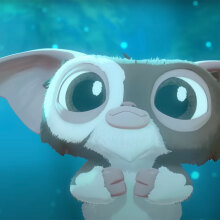 A little furry animated creature with pointy ears and large eyes stares into the distance.