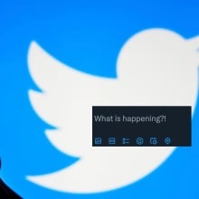 silhouette holding phone in front of twitter logo and a screenshot of twitter prompt reading "what's happening"  