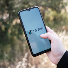 A TikTok logo seen displayed on a smartphone screen.