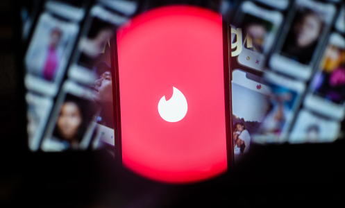 A photo illustration of the dating app Tinder on iPhone screen