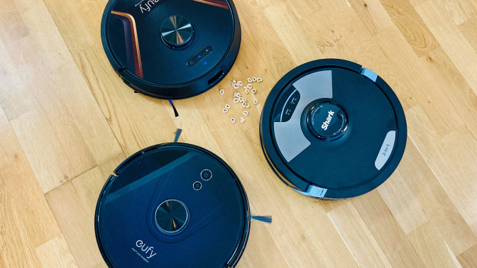 Two eufy robot vacuum mop hybrids and a Shark.