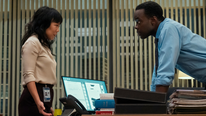 Ali Ahn and Ato Essandoh stand across from each other in an office in "The Diplomat."