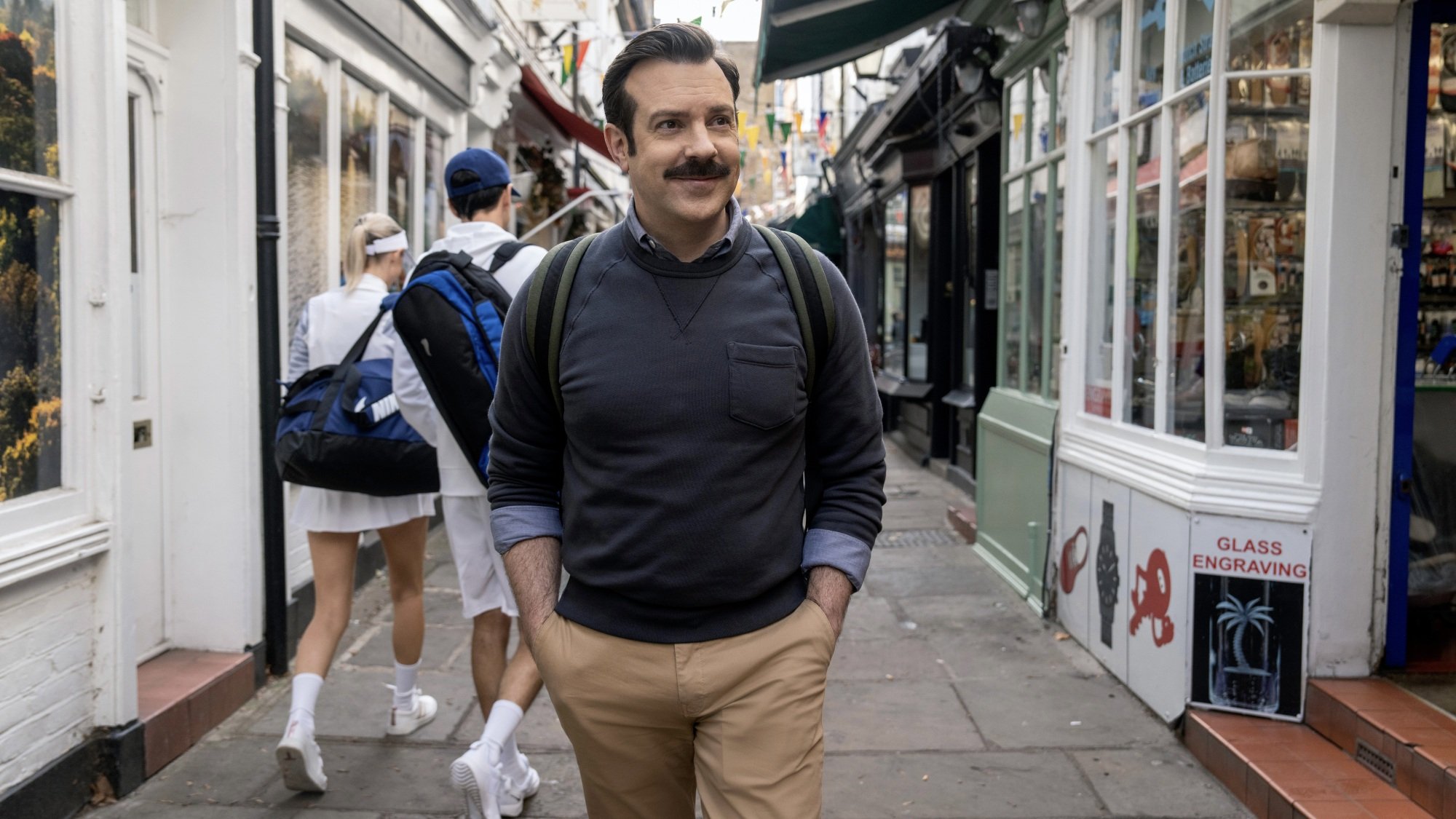 Ted Lasso walking through the streets of London.