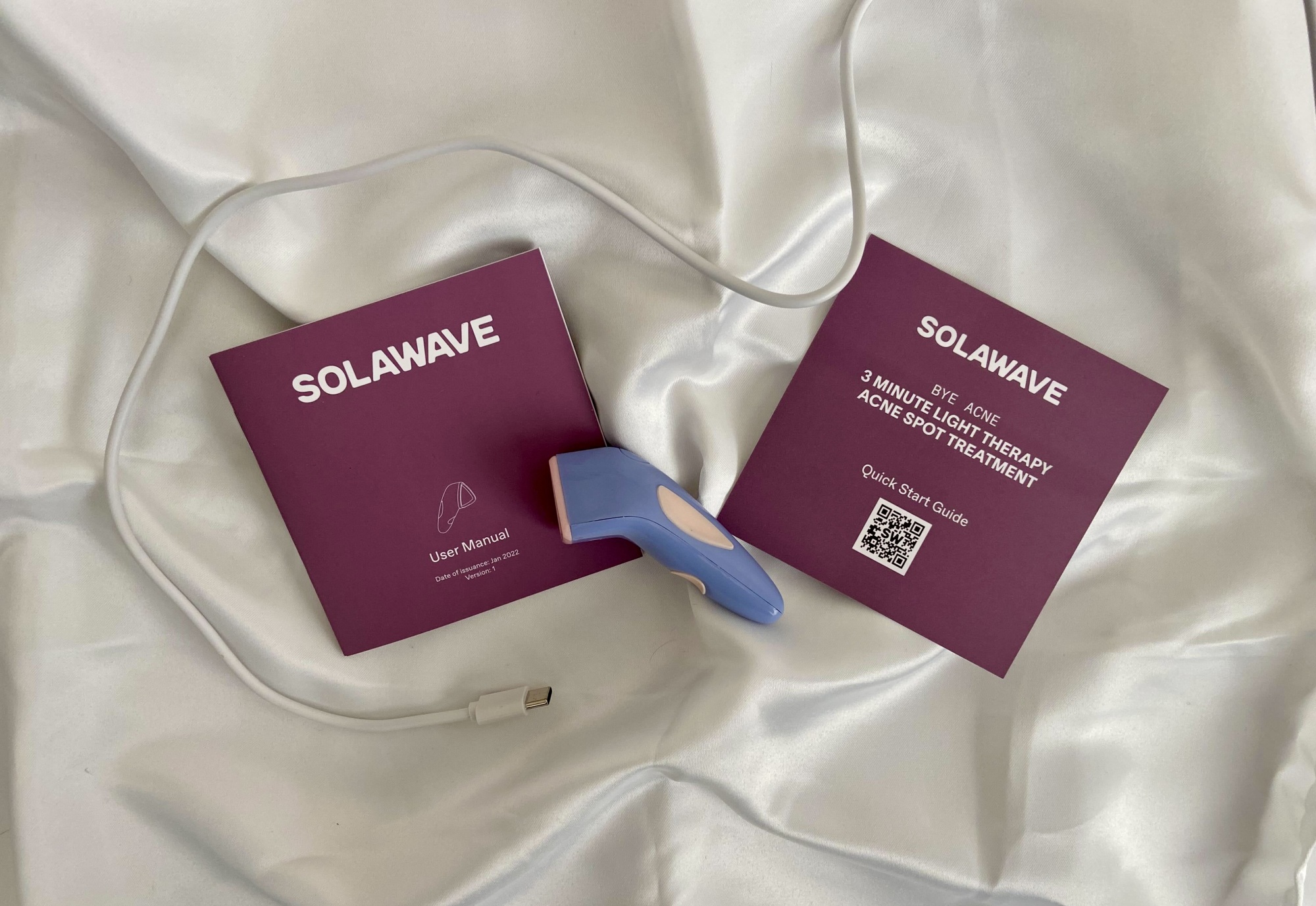 solawave bye acne device with start guides and charging cord