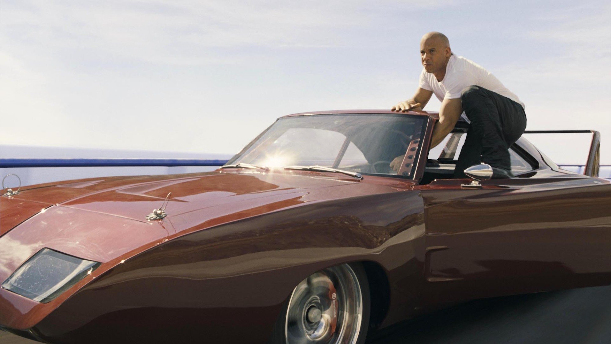 Vin Diesel stands on a speeding car in "Fast & Furious 6"