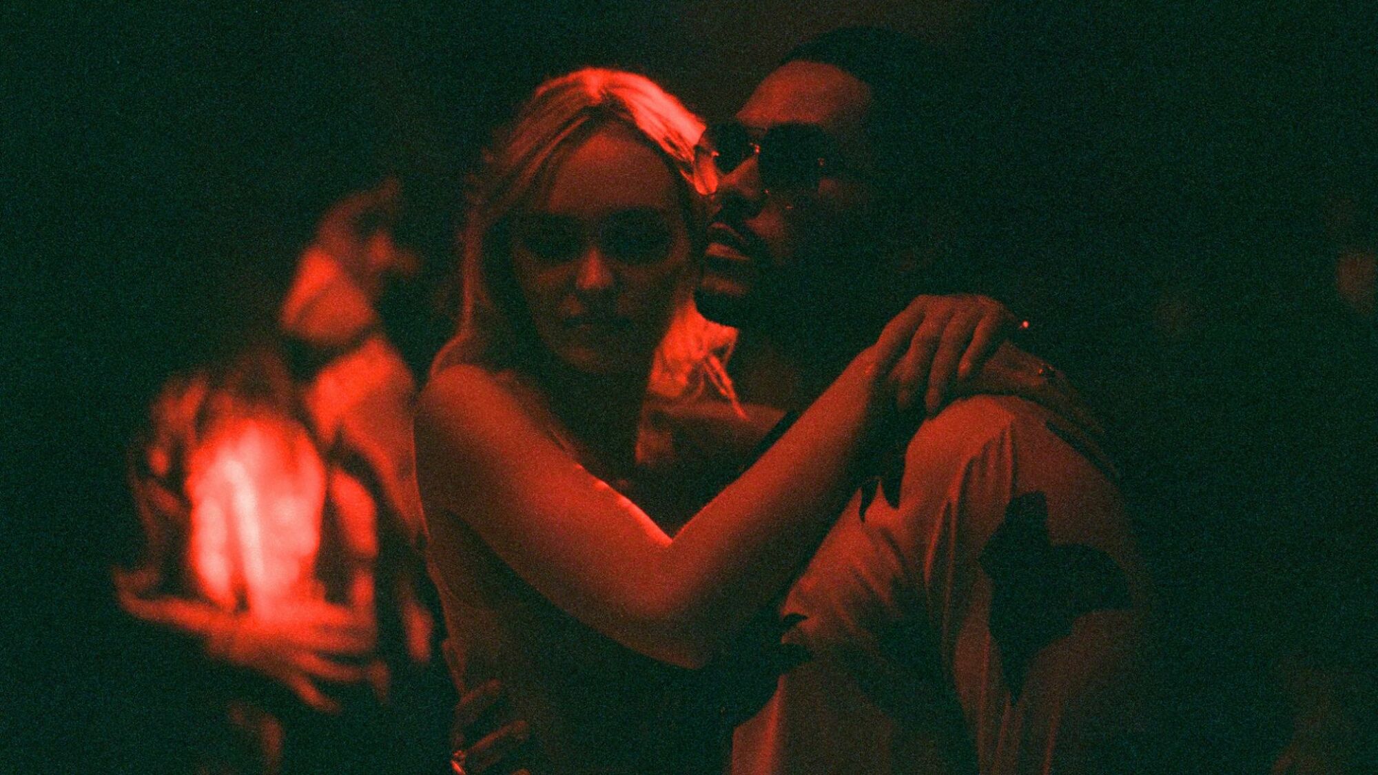 Lily-Rose Depp and Abel “The Weeknd” Tesfaye embrace in "The Idol."