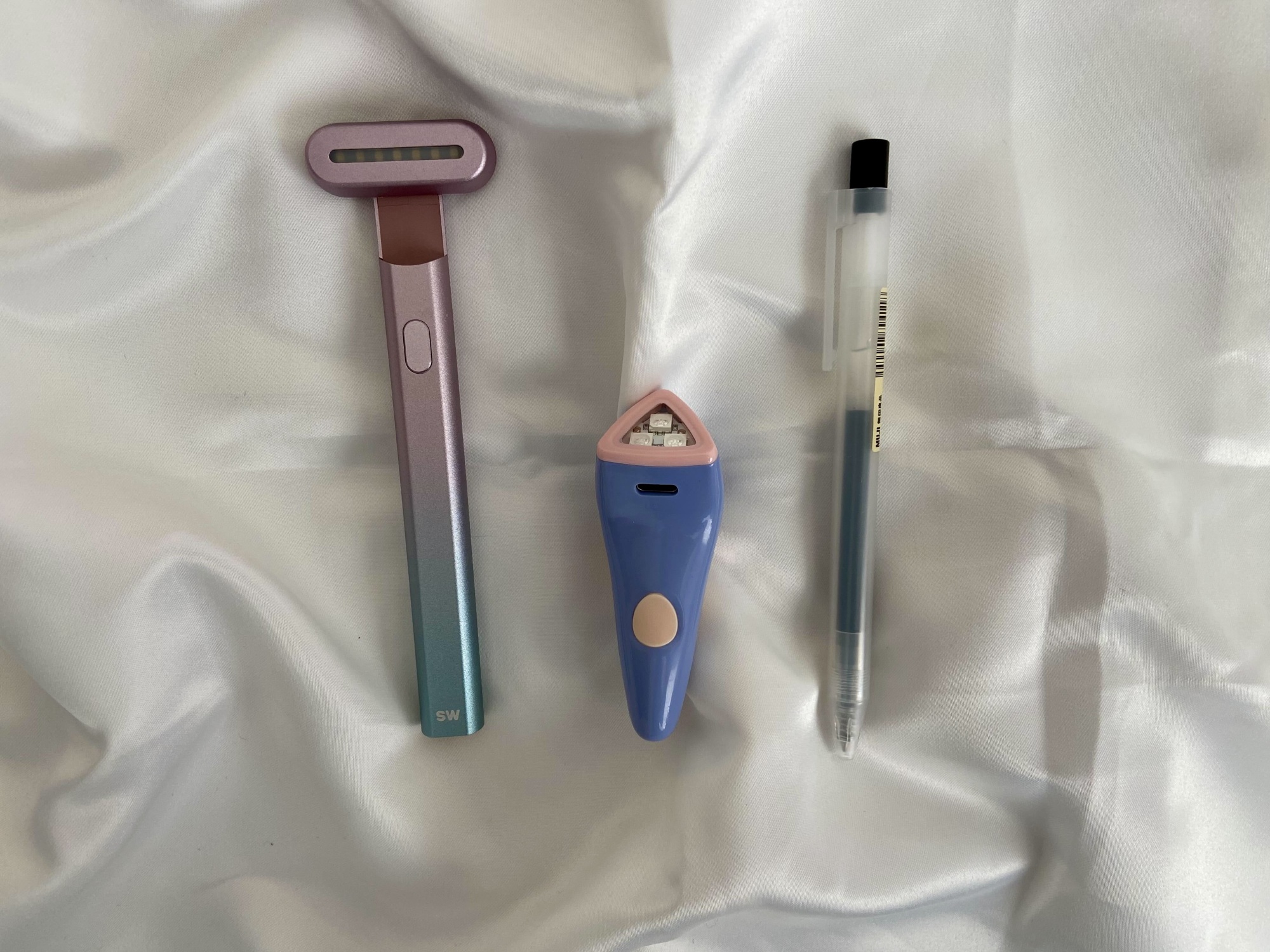 solawave rejuvenating wand, solawave bye acne device, and a muji