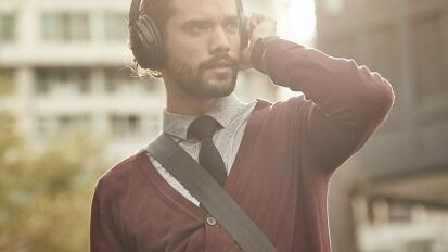 Person wearing the Bose QuietComfort headphones.