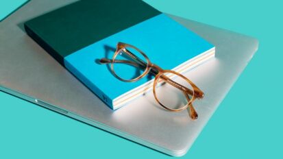Felix Gray glasses on a blue background.