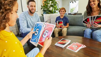 A family playing giant uno.
