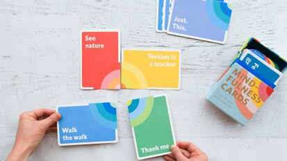 Colorful mindfulness cards on a white table
