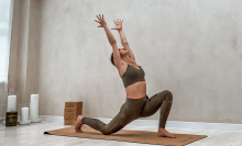 woman doing yoga pose in studio