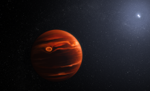 An exoplanet orbiting twin stars