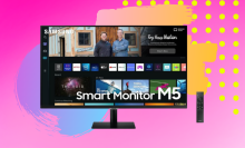 Smart monitor with streaming menu against a pink background with yellow polka dots, purple and blue, and golden yellow.