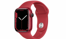 Red apple watch on white background.