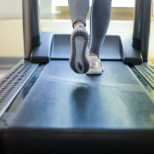 person walking on treadmill