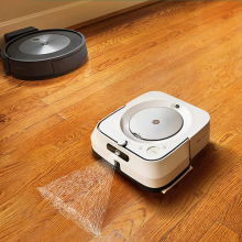 Roomba mopping a wood floor