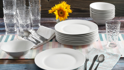 48-piece dinnerware set from Gibson Home on a dinner table