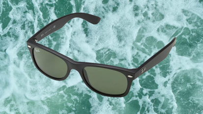 Ray-Ban Wayfarer Sunglasses on an ocean background.
