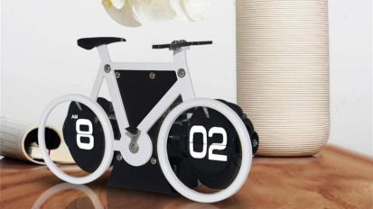 KABB retro style bicycle shaped flip down clock on a table.