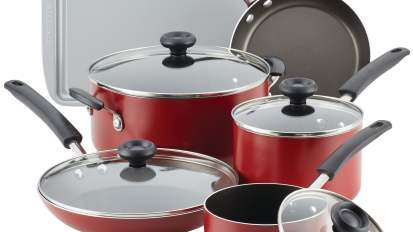 Set of red Farberware nonstick cookware on a white background.