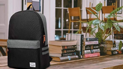 a backpack sitting on a table with a stack of books