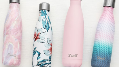 various pink and printed s'well bottles