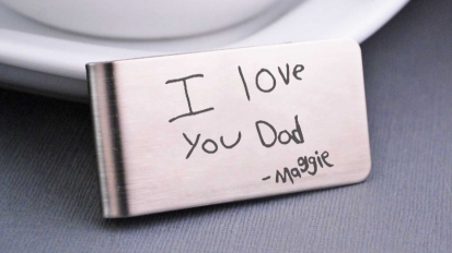A personalized money clip with 'I love you Dad" on it. 