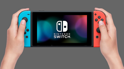 A person holding a Nintendo Switch.