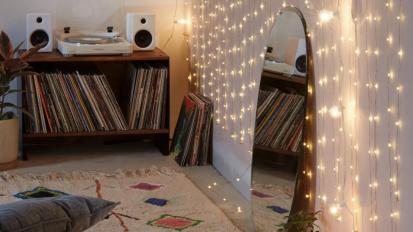 Bedroom with string lights hanging on wall