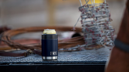 A Yeti Rambler Colster on a table.