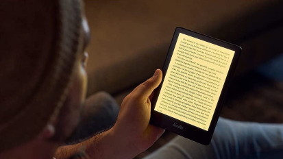 Person holding a new Kindle Paperwhite.