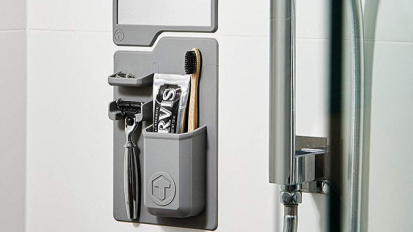 A Tooletries shower organizer on a bathroom door.