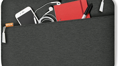 a gray laptop sleeve with a phone, earbuds, and other gear in the front pocket