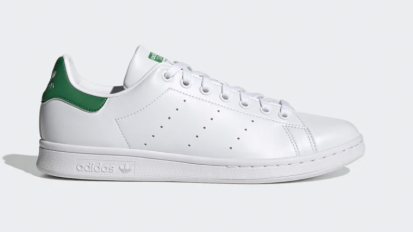 White and green sneakers on a white background.