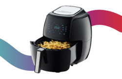 Basket style air fryer full of french fries